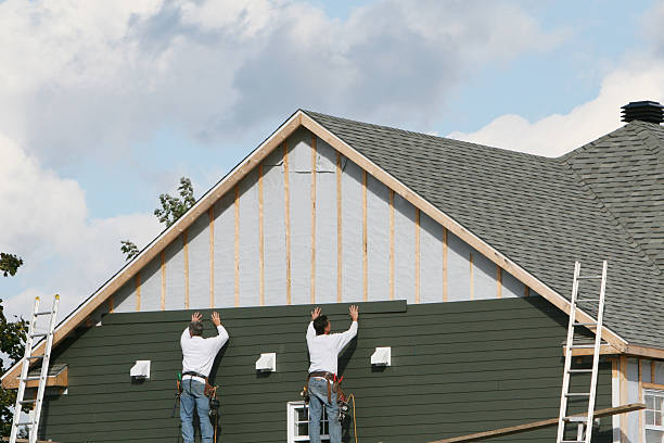Professional Storm Damage Siding Repair technician working in Luxor, PA